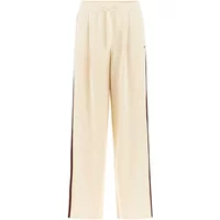 Beige women's trousers by Guess, featuring a relaxed fit, elastic waistband, and side stripes.