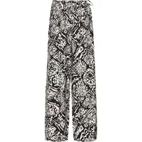 Black and white patterned women's trousers by Ichi, featuring a high waist and wide-leg design.
