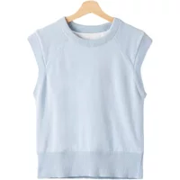 Light blue women's vest, sleeveless with ribbed hem and crew neck, on wooden hanger.