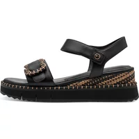Black Tamaris wedge sandals with ankle strap, braided detailing, and thick sole.