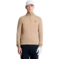 Beige wool sweater by Lyle & Scott with quarter zip, embroidered logo on chest, worn by model with cap and glove.