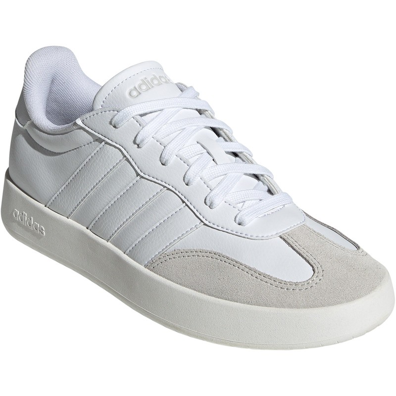White leather trainers with natural suede accents, featuring three signature Adidas stripes, a cushioned sole, and a sleek, minimalist design.
