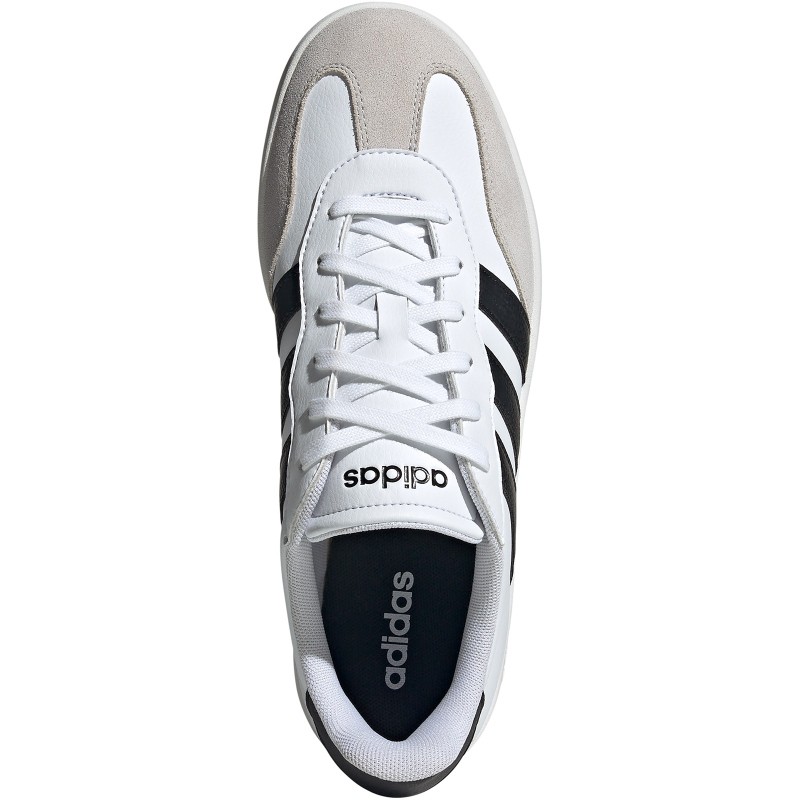 White and grey children's trainers by Adidas, featuring a suede and synthetic upper, black stripes, and a cushioned sole for comfort.