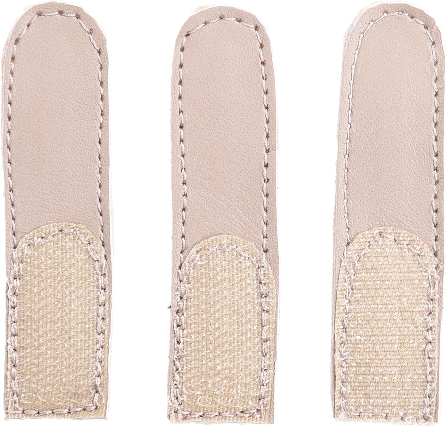 Three beige strap extensions made of soft leather with stitched edges and textured fabric patches for added grip, designed to enhance comfort in footwear.