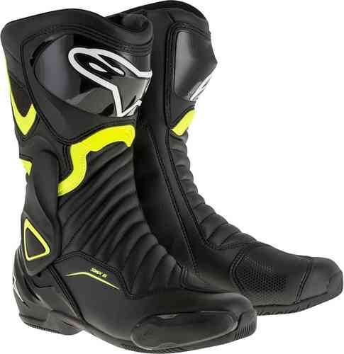Black motorcycle racing boots with yellow accents, featuring a sleek design, reinforced toe and heel, and textured panels for grip and flexibility.