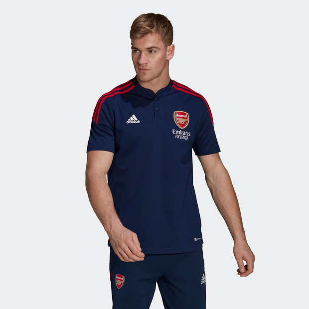 Navy blue Adidas Arsenal Condivo 22 polo shirt featuring red shoulder stripes, embroidered club logo, and "Emirates Fly Better" branding, made from breathable material.