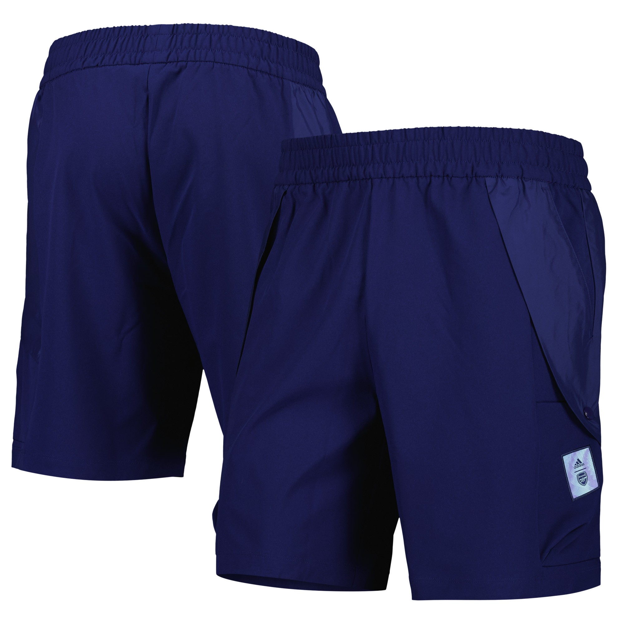 Navy woven shorts by Arsenal, featuring an elastic waistband, side pockets, and a small logo patch, made from lightweight material for comfort and style.