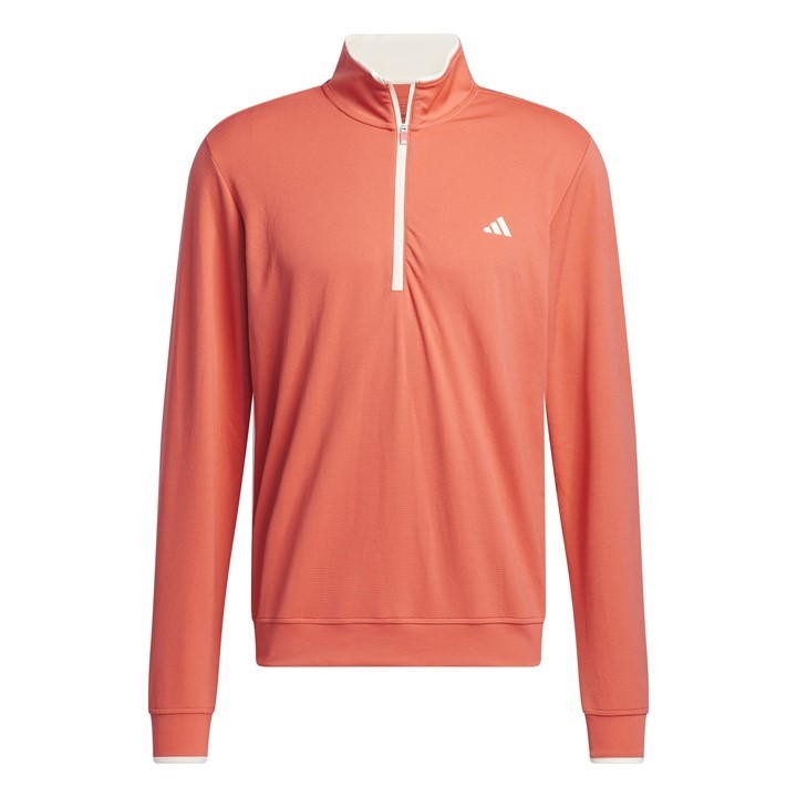 Light pink Adidas quarter-zip pullover featuring a high collar, long sleeves, and a subtle white logo on the chest. Made from a lightweight, breathable material.