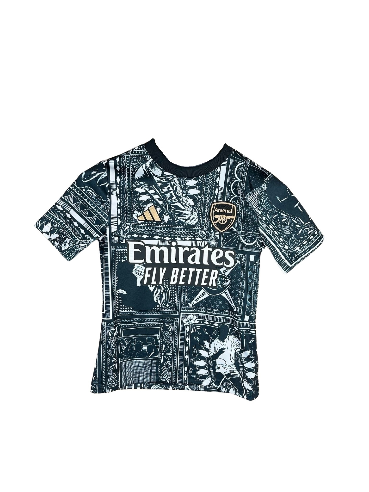 Black kids' pre-match shirt featuring intricate white graphic patterns, Adidas logo, and "Emirates Fly Better" text on the front, designed for Arsenal fans.