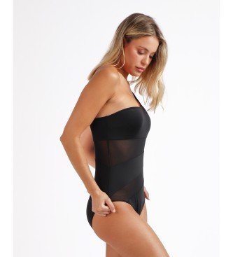 Asymmetrical sheer black one-piece swimming costume featuring a strapless design and contrasting sheer panels, ideal for a stylish swimwear look.