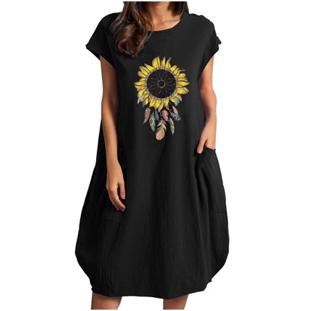 Black loose flowy crewneck dress made of cotton and linen, featuring a vibrant sunflower and feather print, short sleeves, and two side pockets.