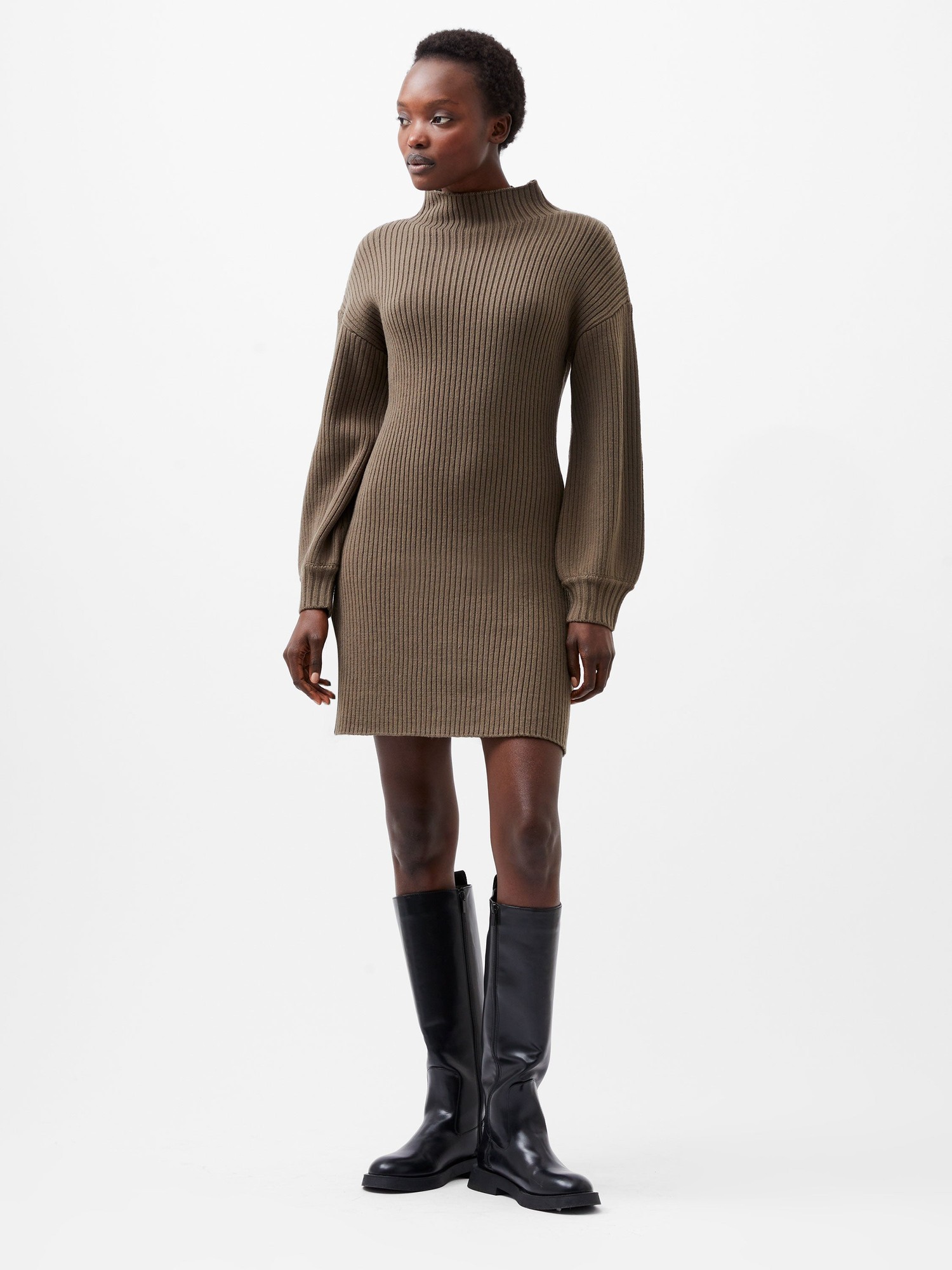 Khaki ribbed knit dress with a high neckline and balloon sleeves, paired with knee-high black boots, showcasing a fitted silhouette.