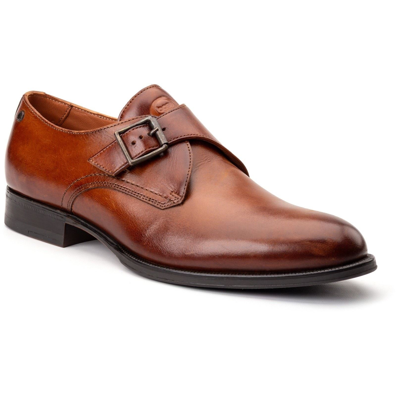 Burnt tan leather men's shoes featuring a sleek design, a decorative buckle on the side, and a polished finish, ideal for formal occasions.