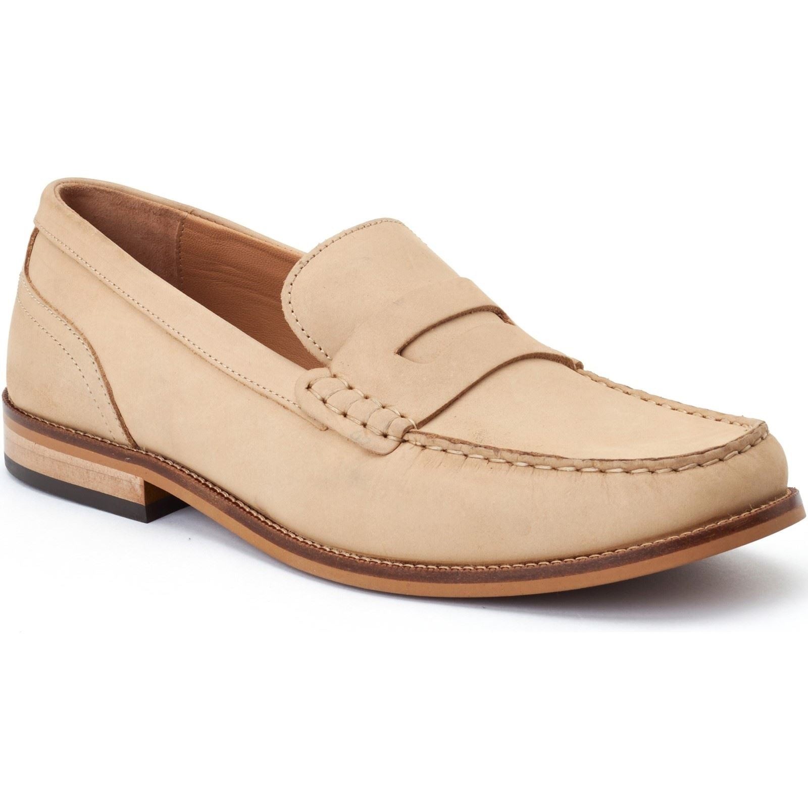 Beige leather loafers featuring a stitched moccasin toe, a smooth upper, and a contrasting brown rubber sole, designed for a classic and stylish look.