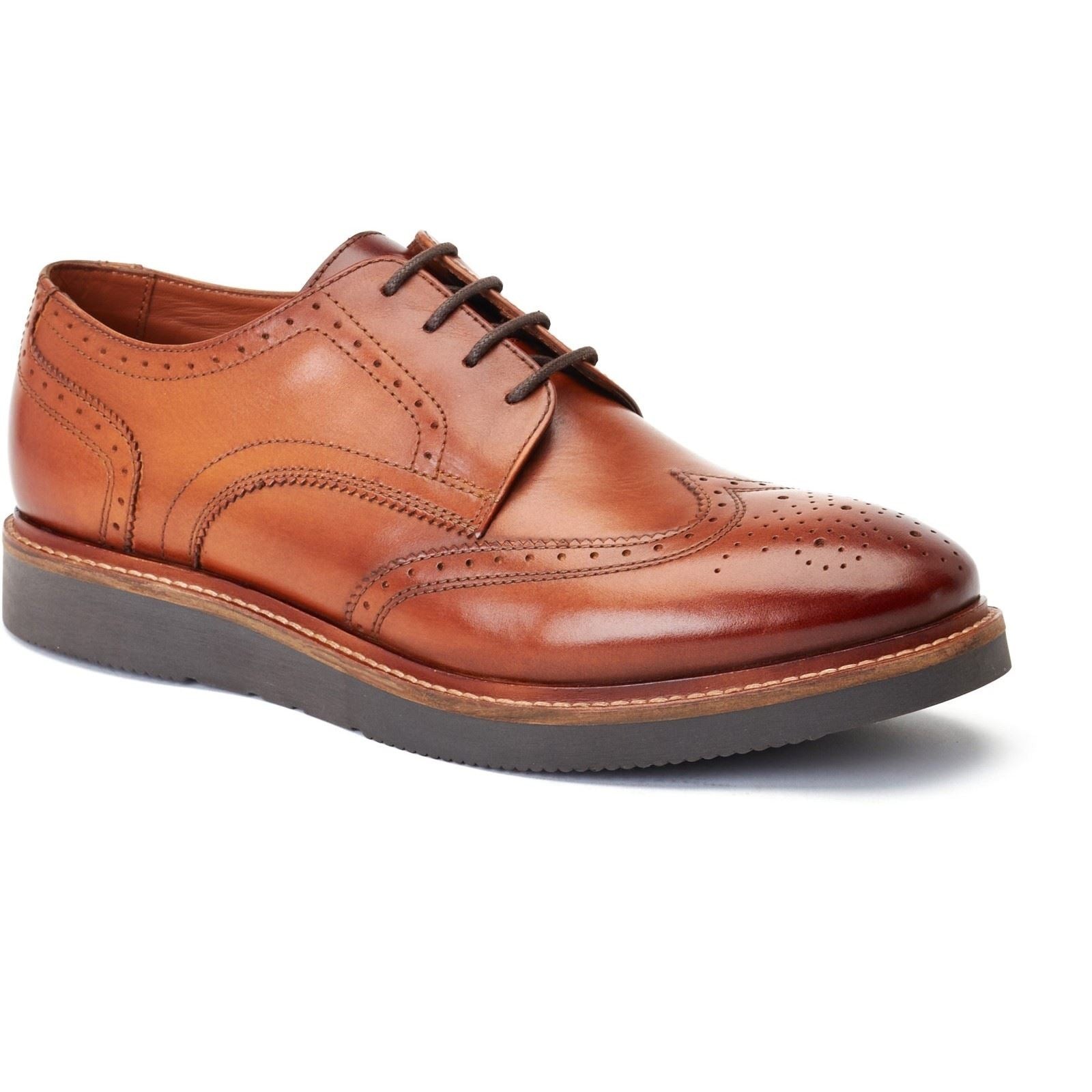 Tan leather brogue shoe featuring perforated detailing, a rounded toe, and a sturdy sole, available in size 7 by Base London.