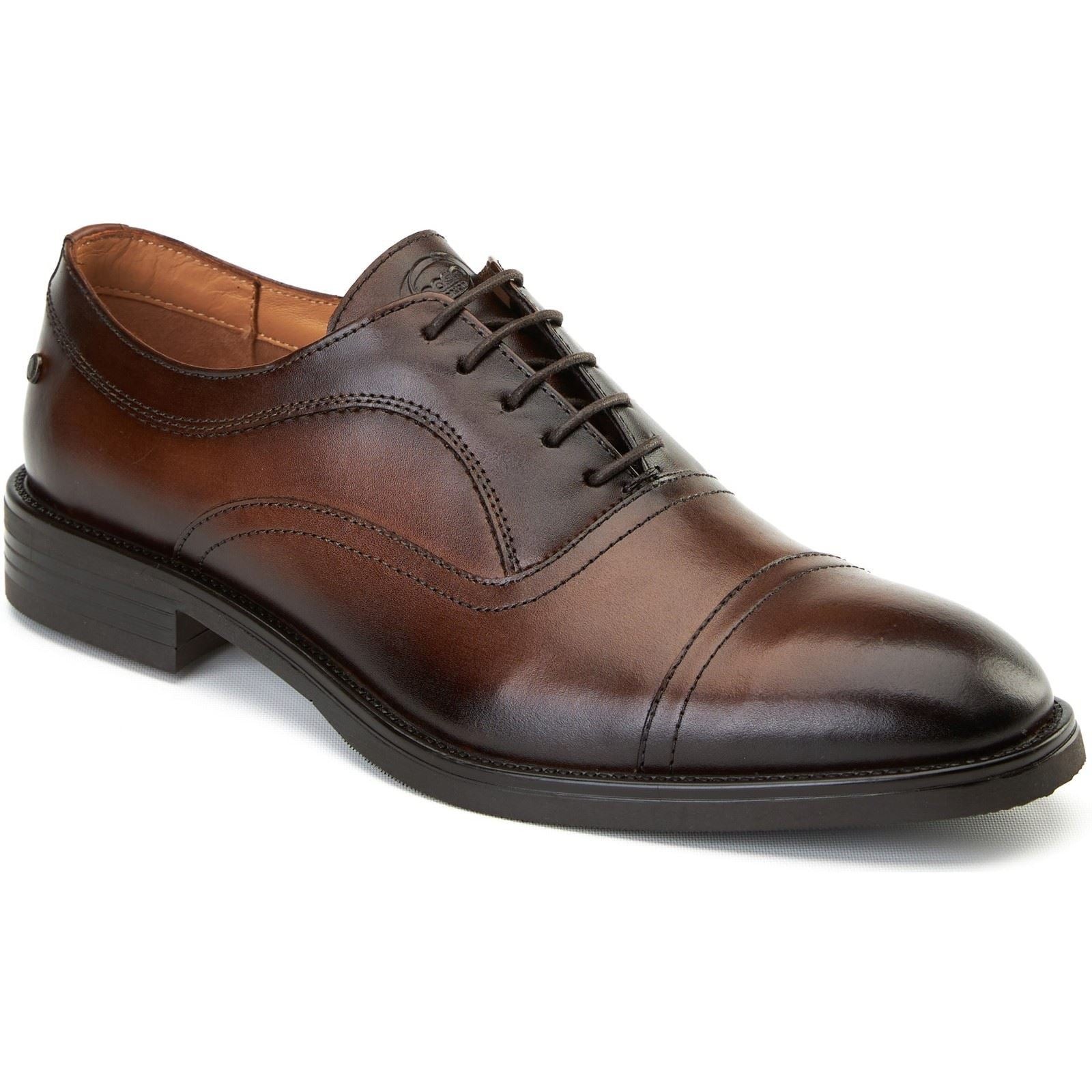 Brown leather Oxford shoes with a sleek design, featuring a cap toe, subtle stitching details, and a low stacked heel, ideal for formal occasions.