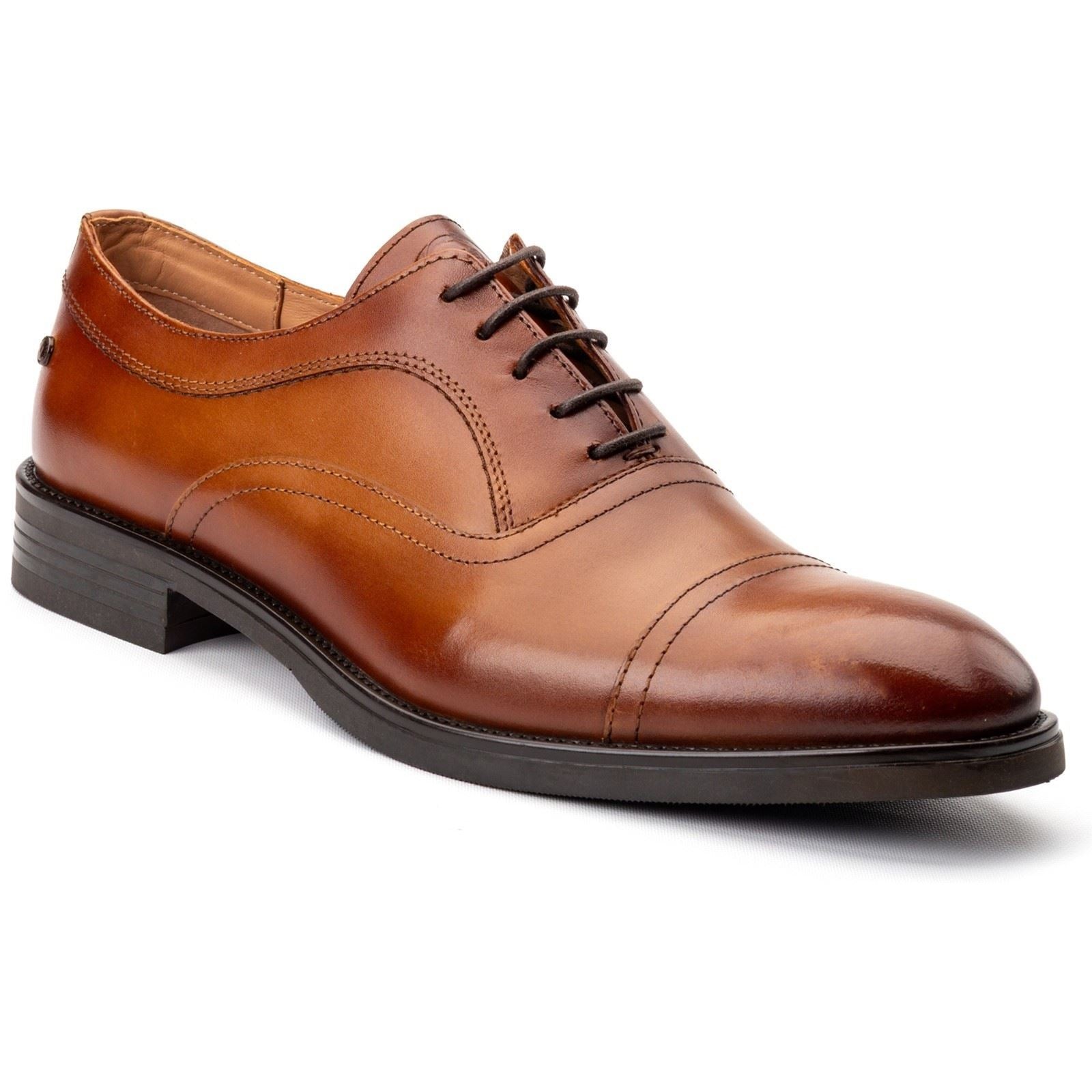 Tan leather Oxford shoes featuring a smooth finish, cap toe design, and classic lace-up closure, set on a sturdy black sole.
