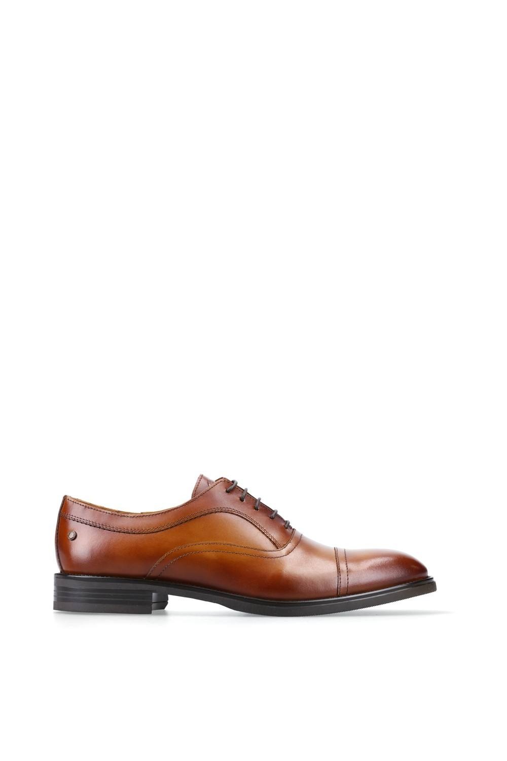 Tan leather lapel toe cap shoe with a sleek design, featuring a lace-up front and a low black heel, size 6, by Base London.