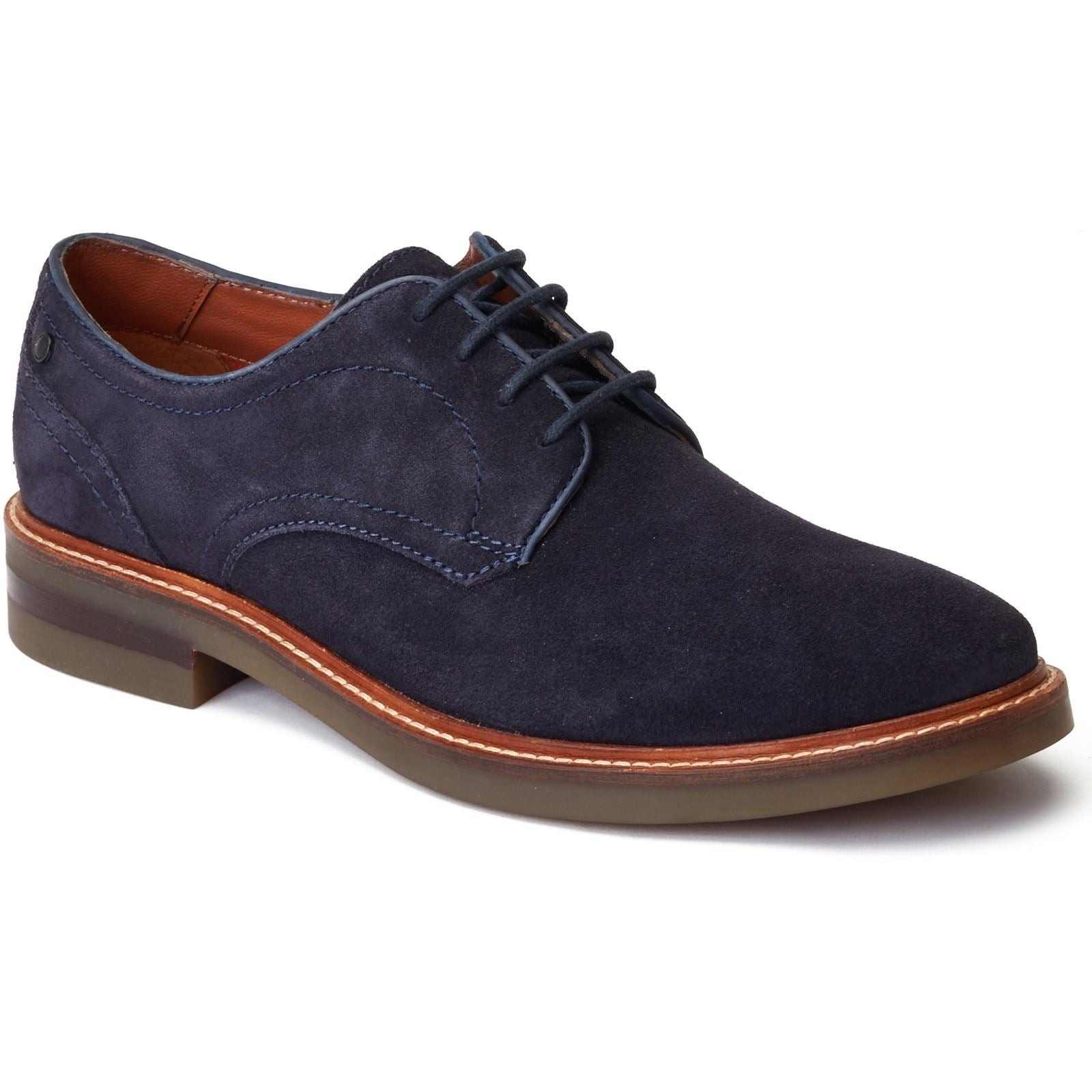 Navy blue suede derby shoe featuring a smooth finish, contrasting stitching, and a brown leather sole with a slight heel.