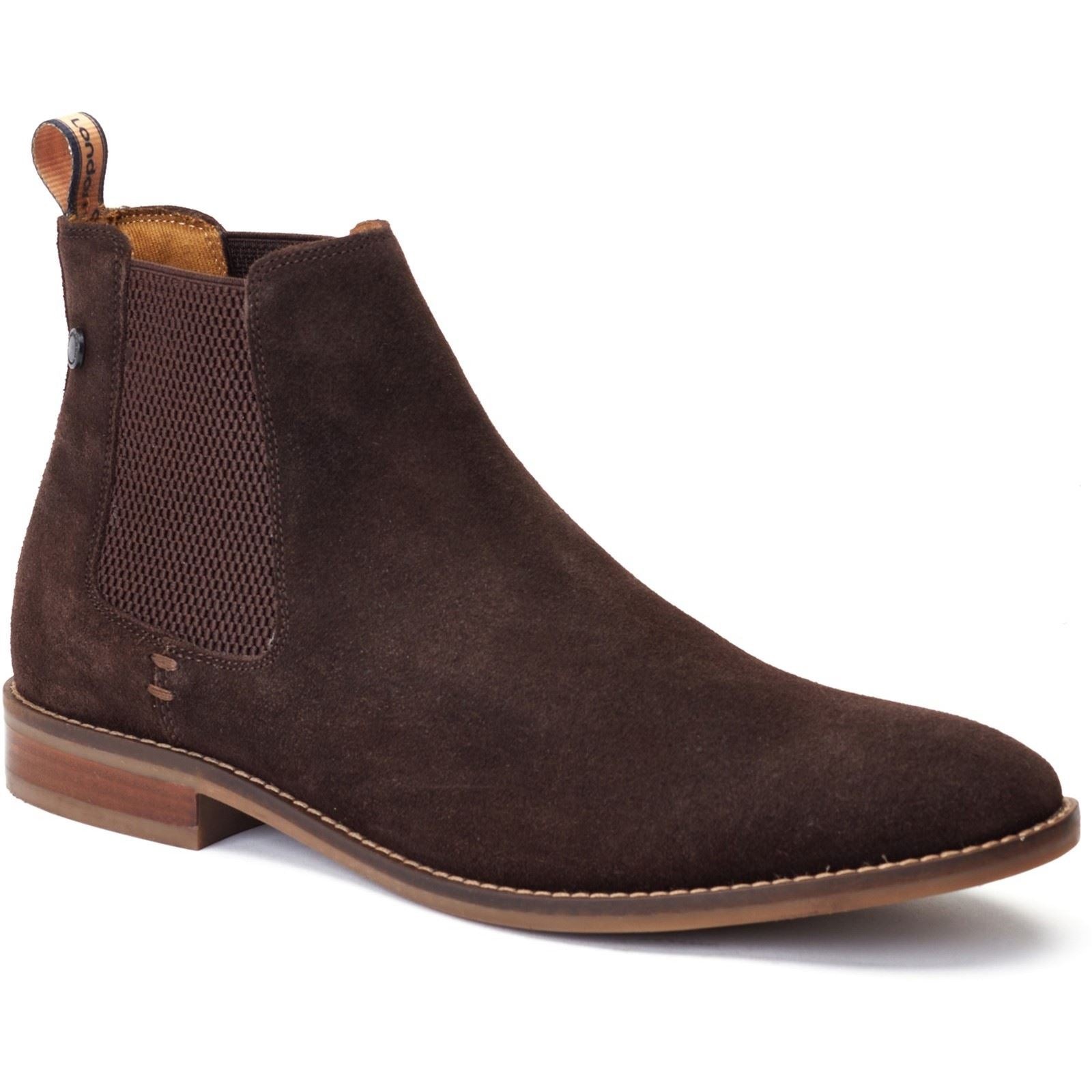 Brown suede Chelsea boot featuring elastic side panels, a pull tab, and a sleek design with a low stacked heel, available in size 6.