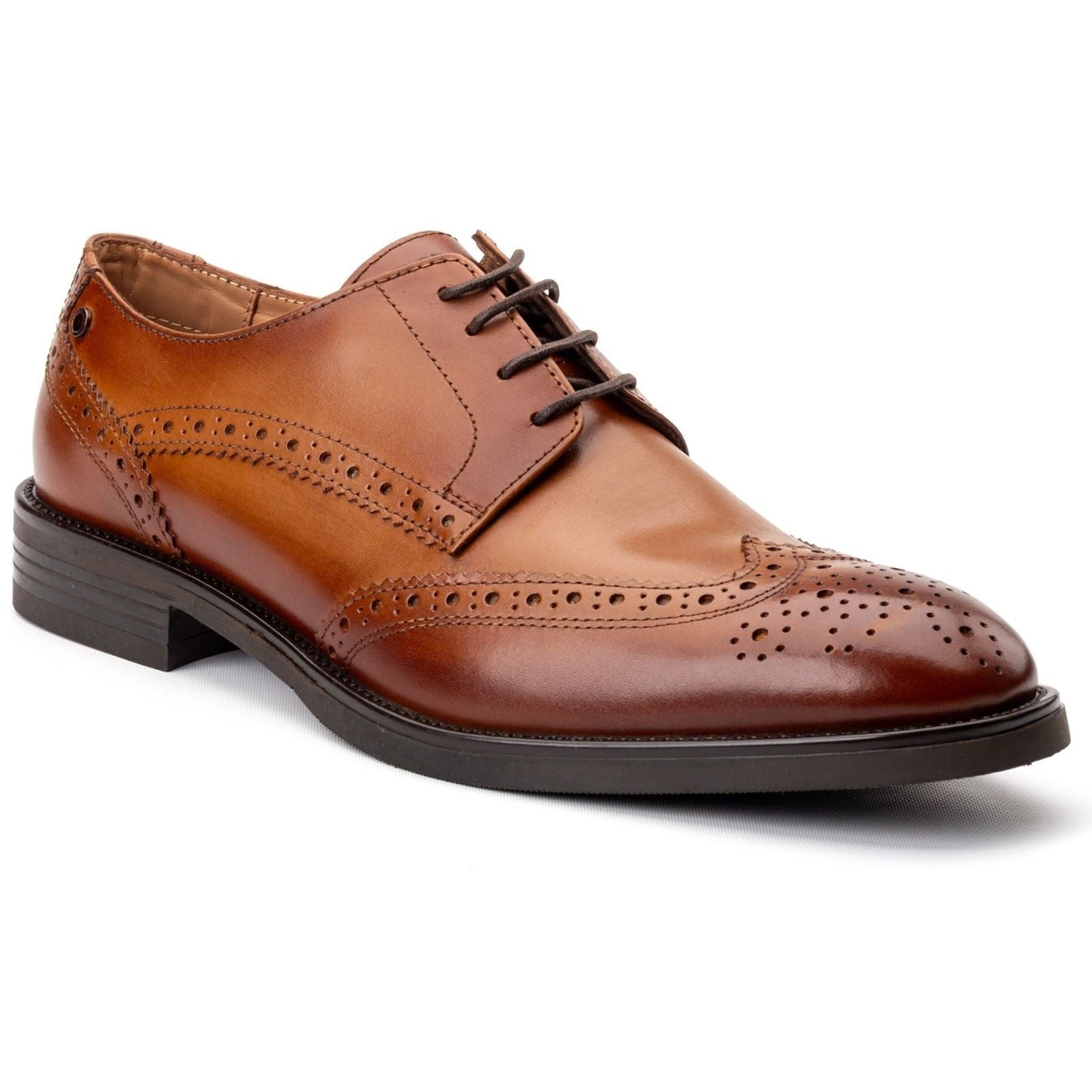 Tan leather brogue shoes featuring intricate perforated detailing, a sleek lace-up design, and a contrasting black sole for a stylish finish.
