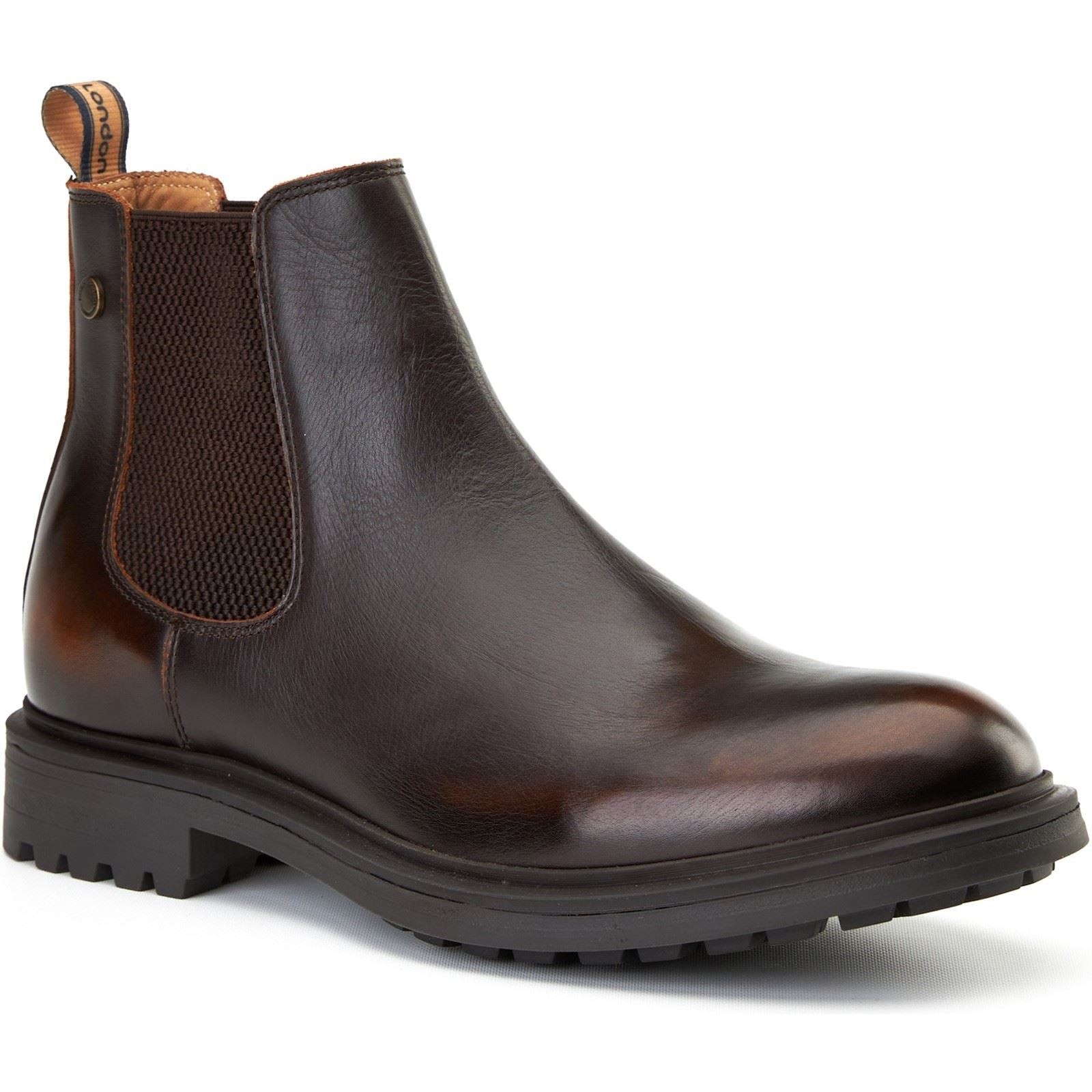 Brown leather ankle boots featuring a sleek design, elastic side panels, a rounded toe, and a rugged rubber sole for traction.