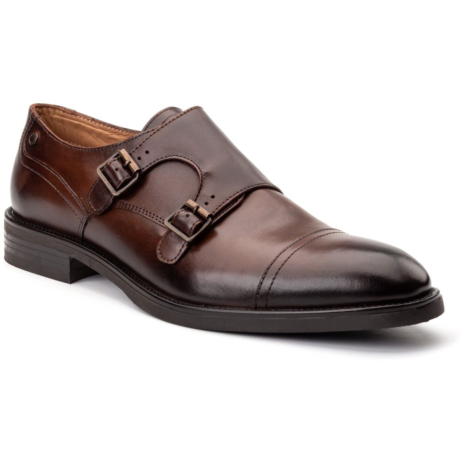 Brown leather double monk shoes featuring two adjustable buckles, a sleek rounded toe, and a low stacked heel, ideal for formal or smart-casual occasions.
