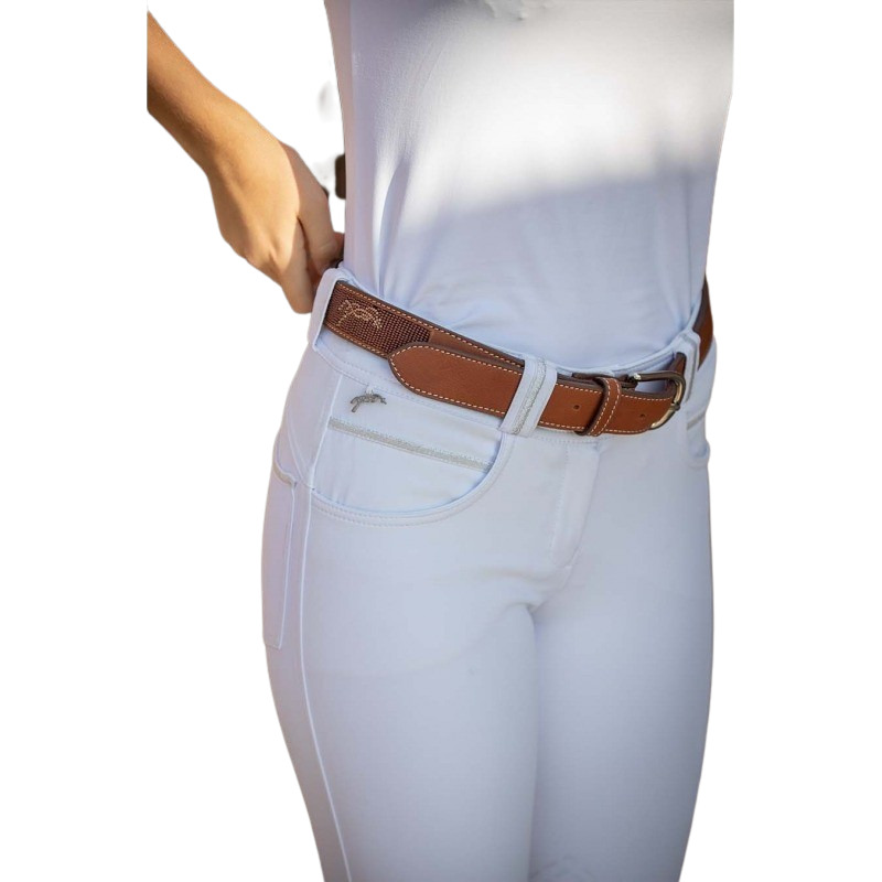 Brown leather belt with a silver buckle, featuring a subtle logo, worn over white pants, highlighting its elegant design and versatility.