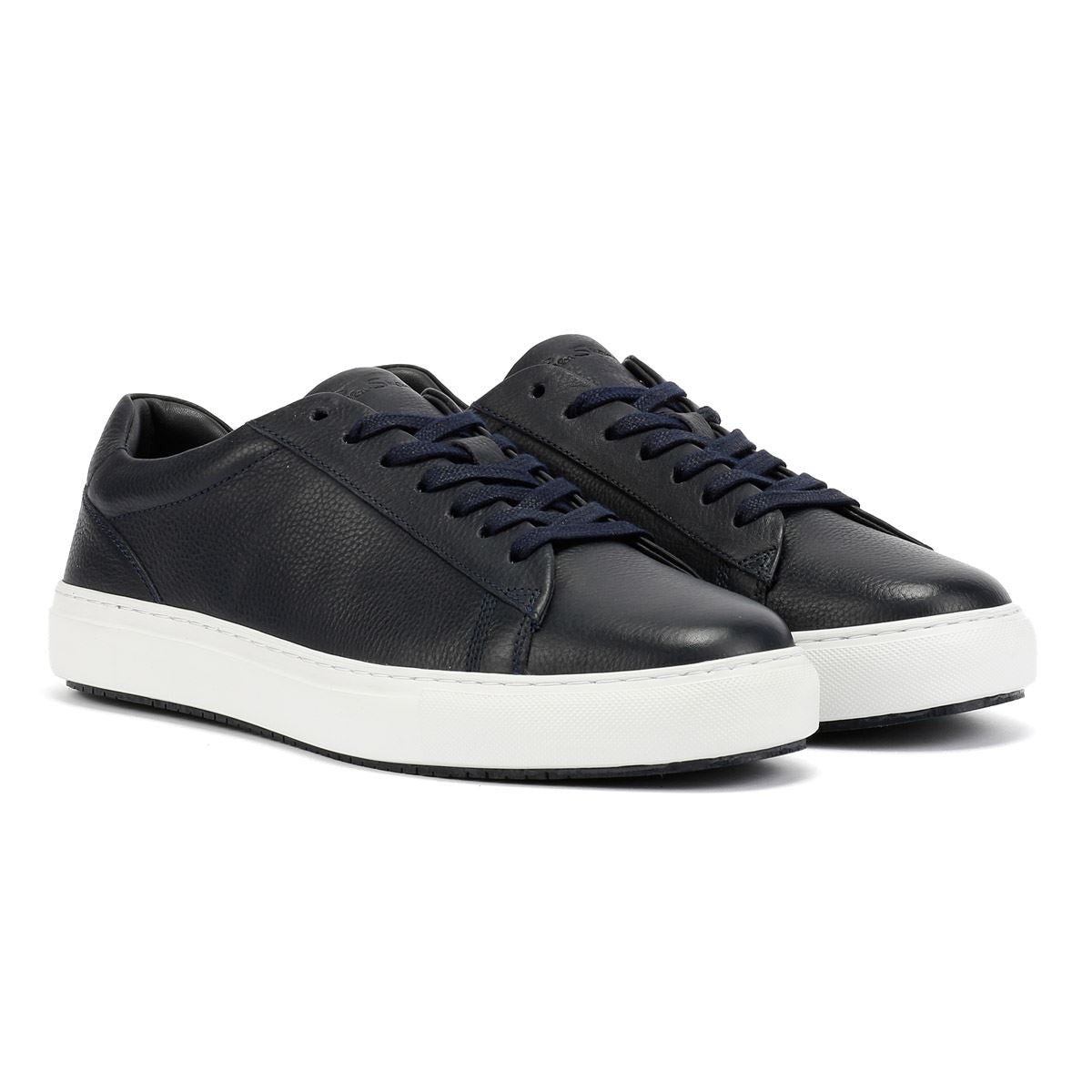 Navy leather trainers with a textured finish, featuring a white cupsole, round laces, and a minimalist design for a sleek, modern look.