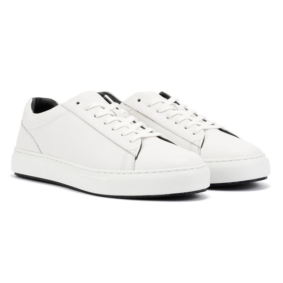 White leather trainers with a sleek design, featuring a round toe, lace-up front, and a contrasting black inner lining, set on a textured white cupsole.