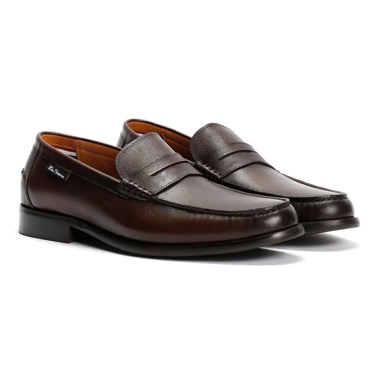 Brown leather loafers with a smooth finish, featuring a stitched seam detail and a low heel, designed by Ben Sherman.