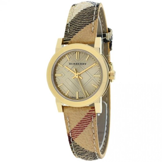Burberry women's watch with a gold-tone case, beige dial featuring a textured pattern, and a Haymarket check strap in tan, red, and black colors.