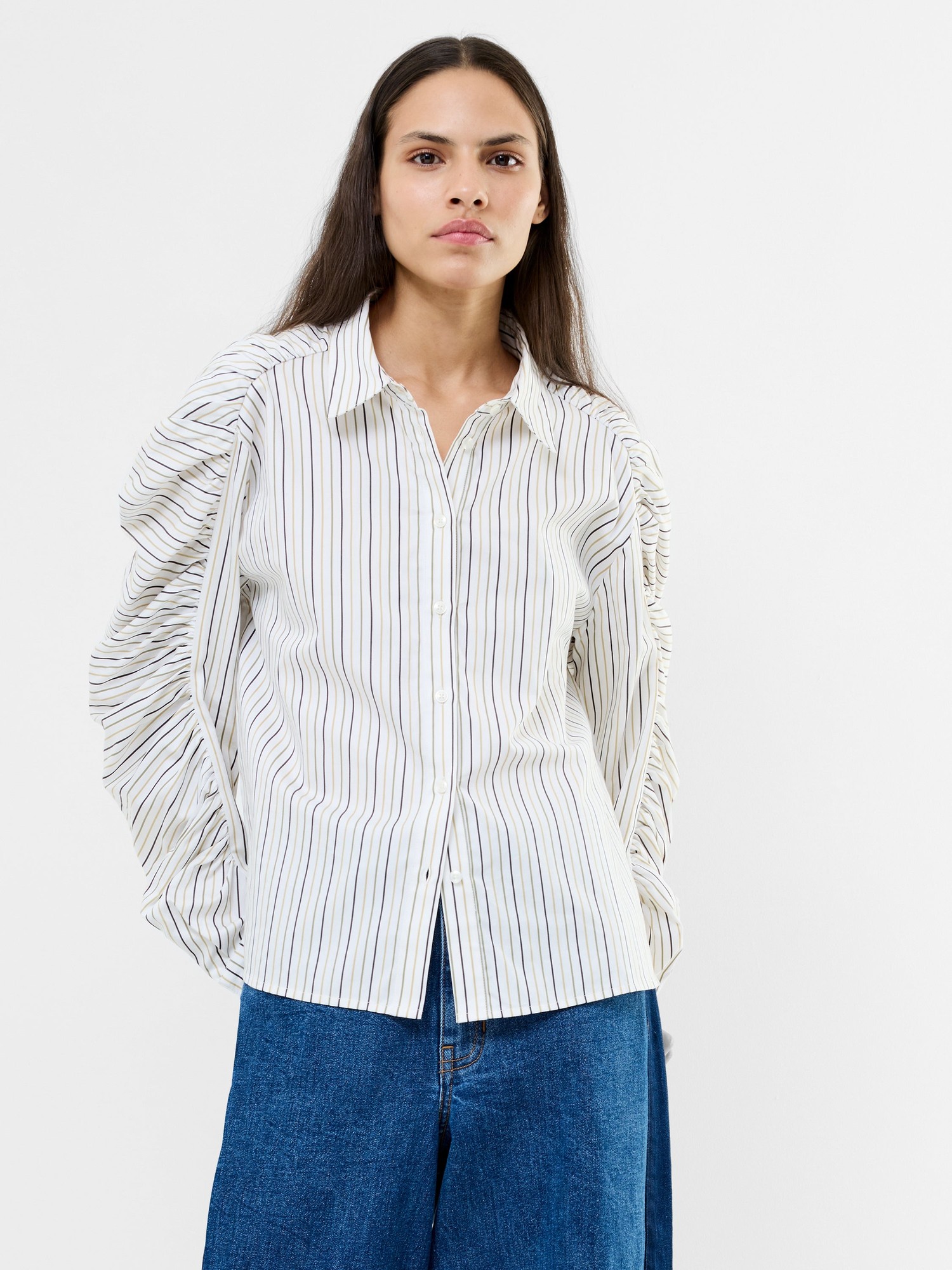 White cotton button-down shirt featuring khaki multi stripes and unique ruched sleeves, styled with a relaxed fit and classic collar.