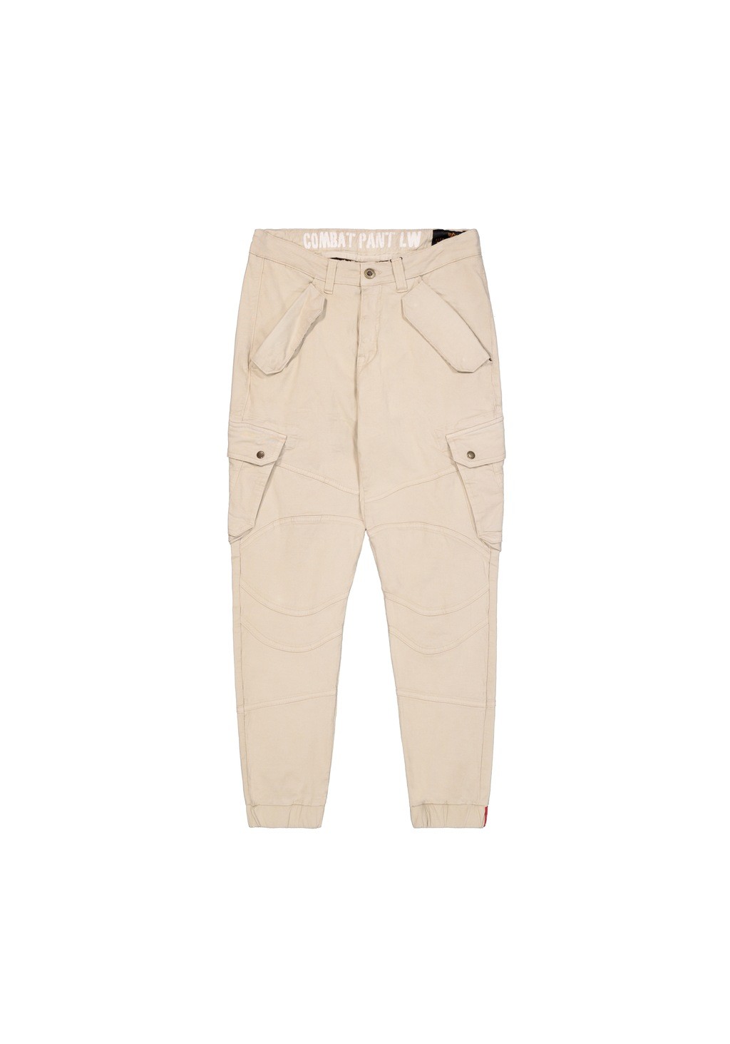 Beige cargo trousers with a tapered fit, featuring multiple front pockets, reinforced knees, and an elastic waistband with "COMBAT PANT" printed on it.