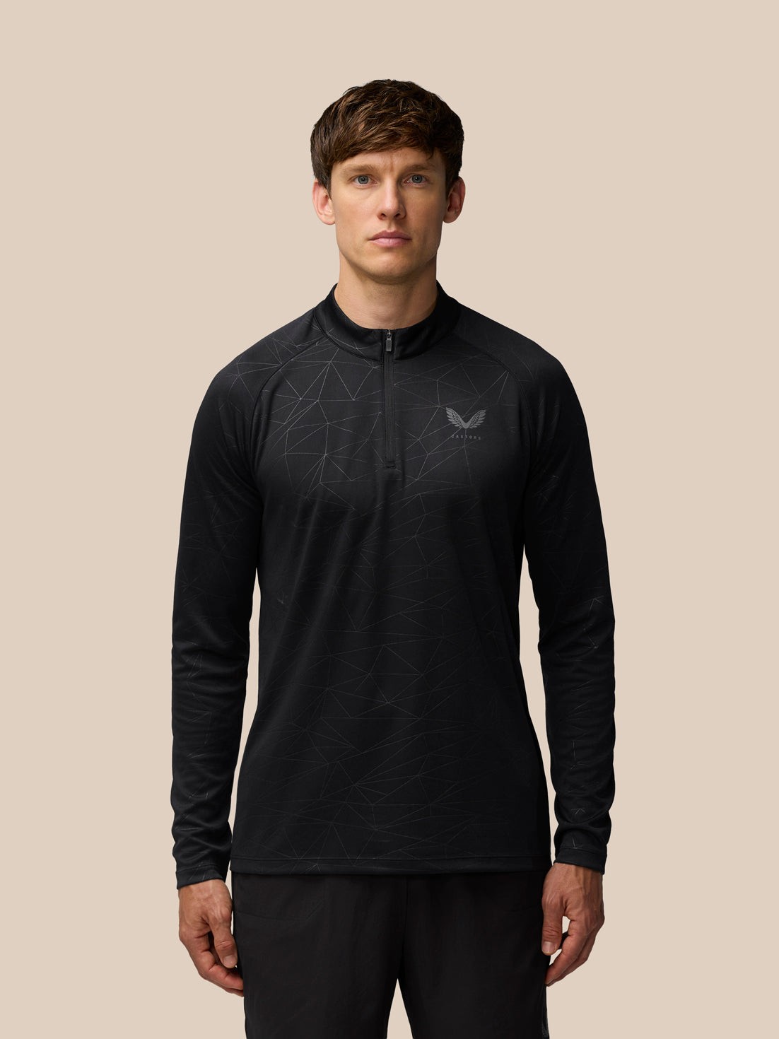 Lightweight black quarter zip t-shirt by Castore, featuring a geometric pattern, long sleeves, and a high collar for a sleek athletic look.