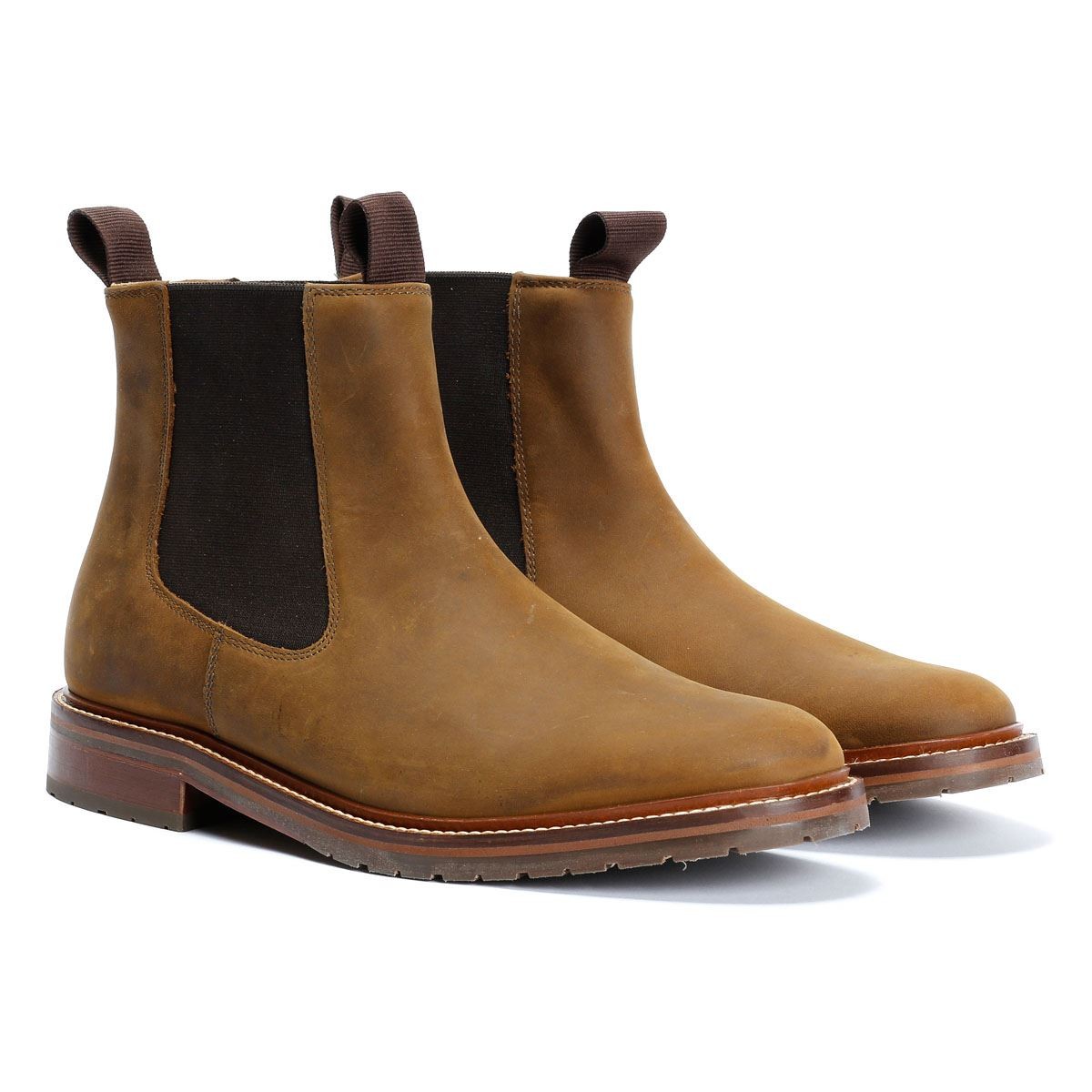 Brown leather Chelsea boots with elastic side panels and pull tabs, featuring a sleek design and a sturdy sole for a classic, versatile look.