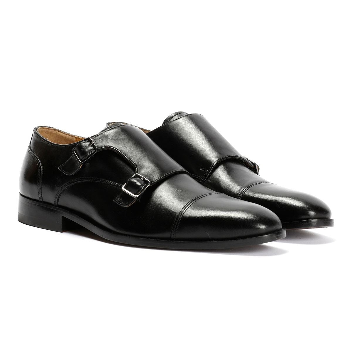 Black leather men's shoes featuring a toe cap design and dual monk straps, with a sleek finish and a polished appearance.