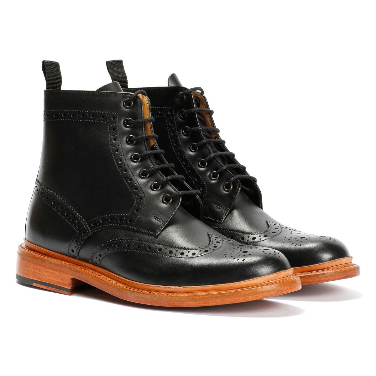 Brown leather brogue boots featuring intricate perforated detailing, lace-up front, pull tab, and a contrasting wooden sole.