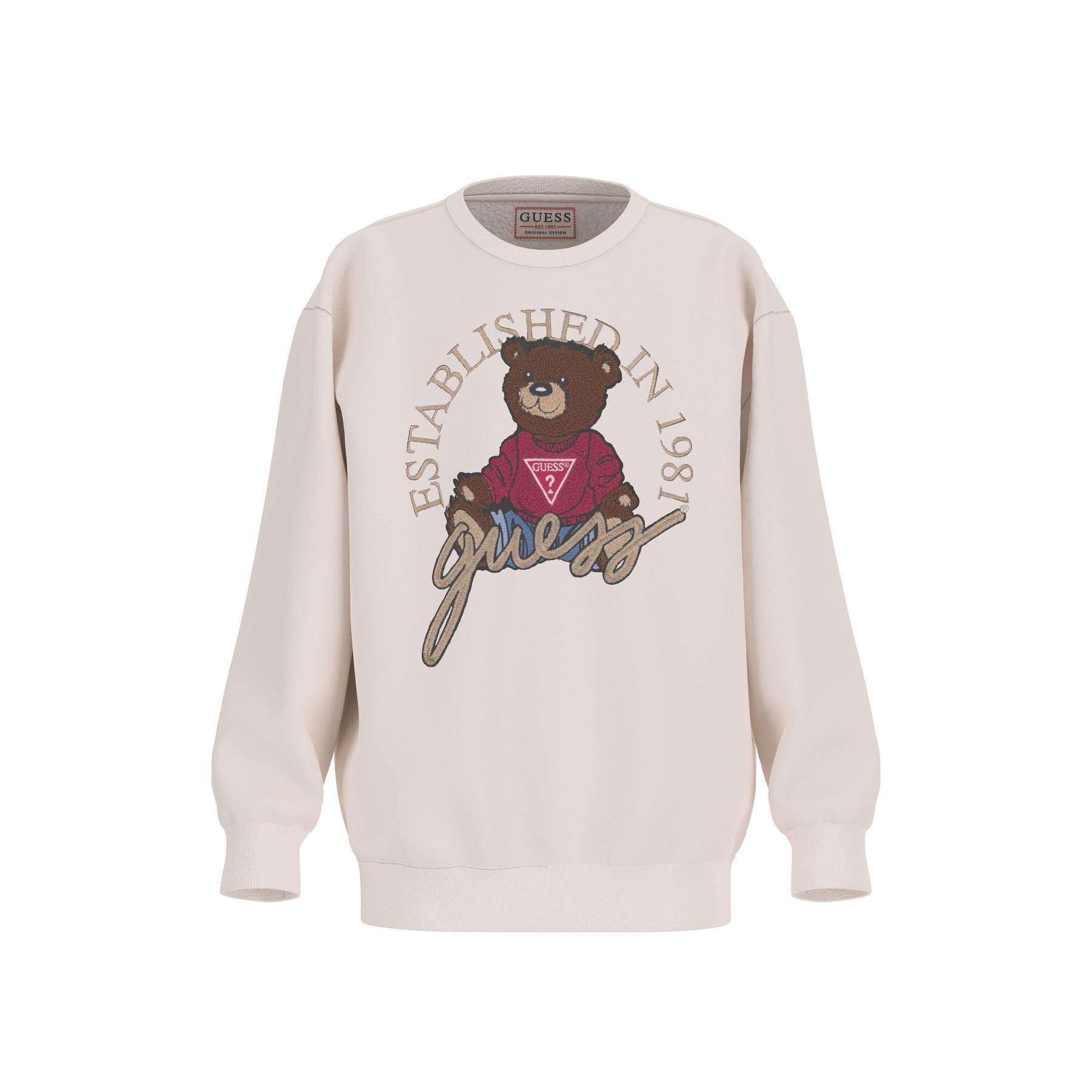 Cream oversized sweatshirt featuring a bear graphic in a red sweater, with "Established in 1981" and "guess" text in gold. Made from soft, comfortable material.