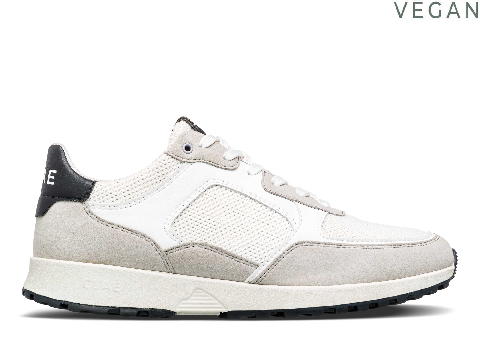 Men's Clae Joshua trainers in microchip grey, white, and navy, featuring a mesh upper, suede accents, and a durable black rubber sole, labeled as vegan-friendly.