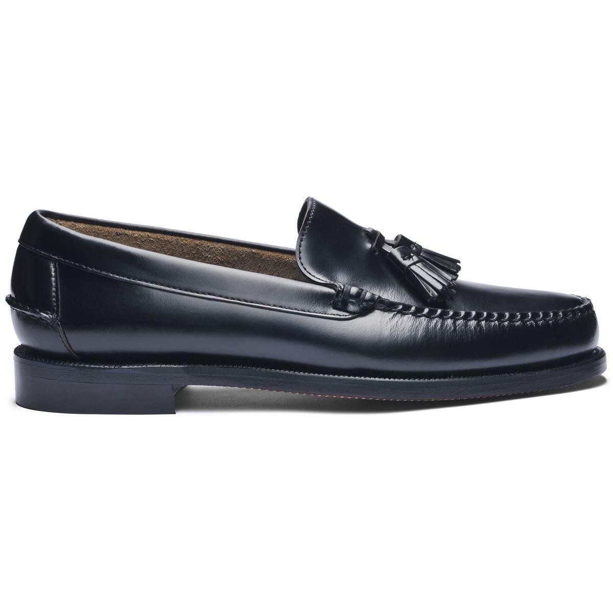 Black leather loafers with a tassel detail, featuring a classic moccasin stitch and a low stacked heel for a sophisticated look.