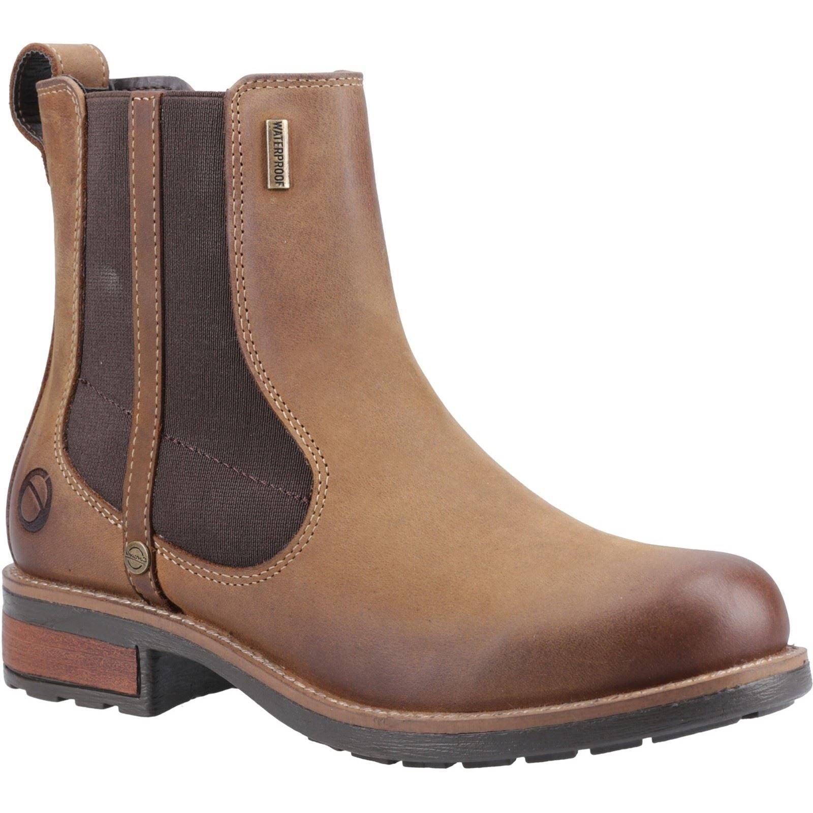Brown leather flat Chelsea boots featuring elastic side panels, a rounded toe, and a sturdy rubber sole, designed for women's comfort and style.