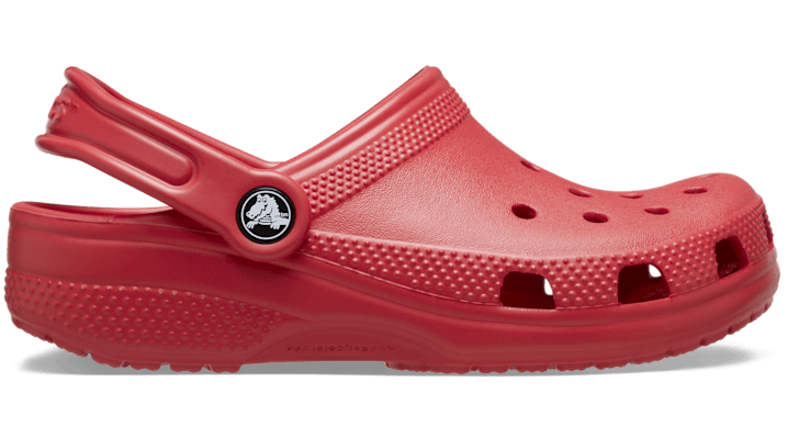 Bright varsity red Kids' Crocs Classic Casual Clogs featuring a lightweight, durable material, ventilation holes, and a back strap for secure fit.