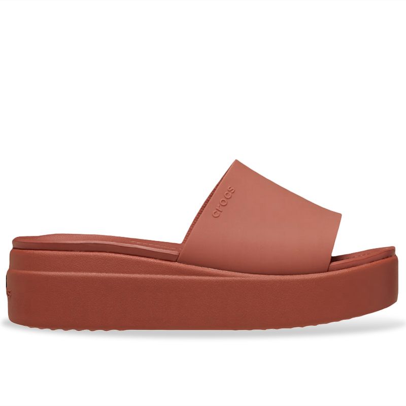 Red Crocs 'Brooklyn Slide' mule featuring a wide, smooth upper strap and a thick, cushioned sole, perfect for summer wear.