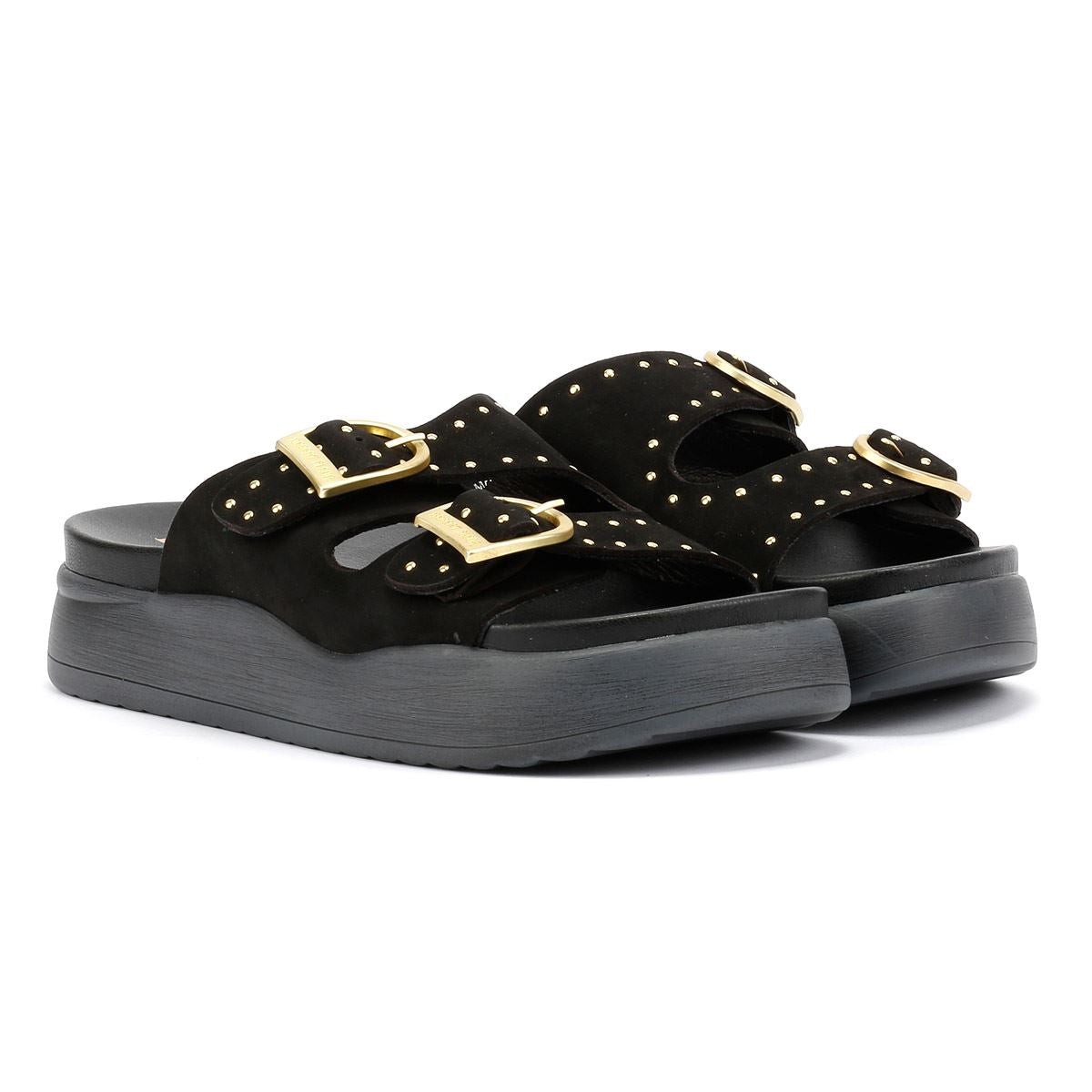Black nubuck sandals featuring two gold buckle straps and studded detailing, set on a chunky black platform sole.