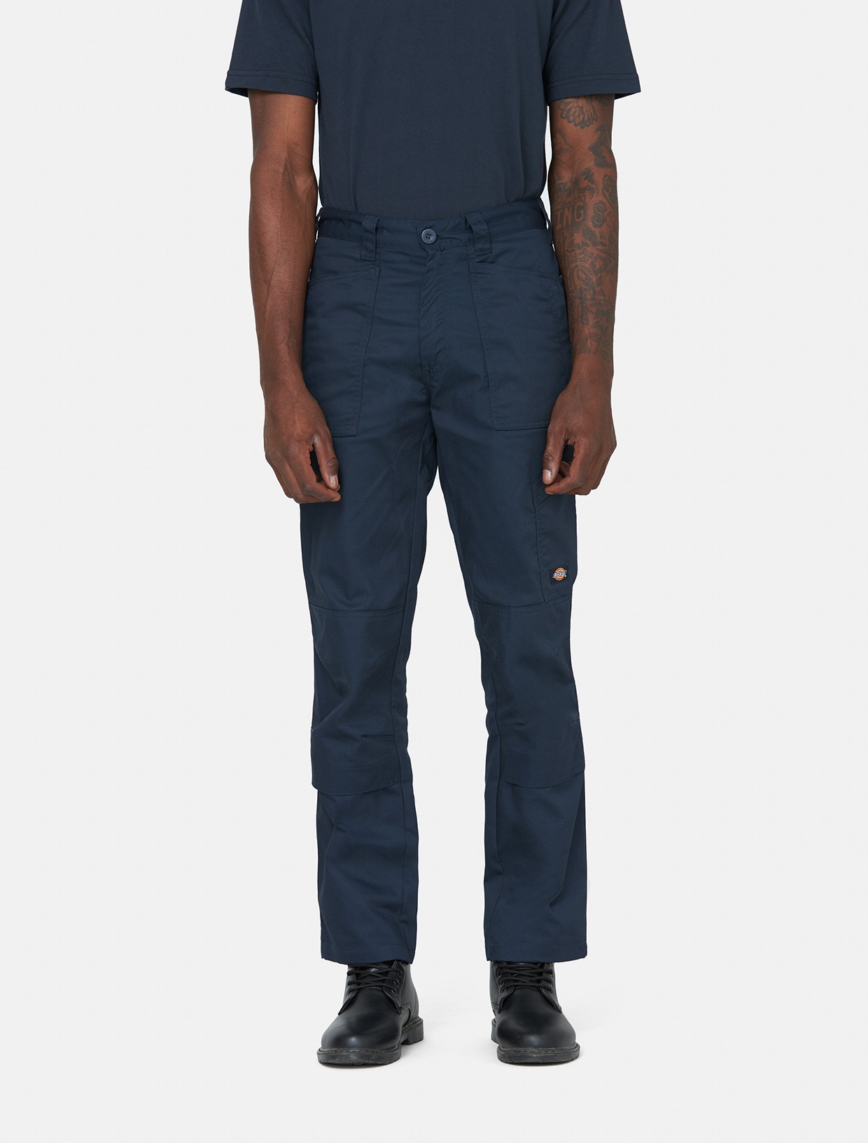 Men's blue outdoor trousers made from durable polyester, featuring a relaxed fit, multiple pockets, and reinforced knees, ideal for active wear.