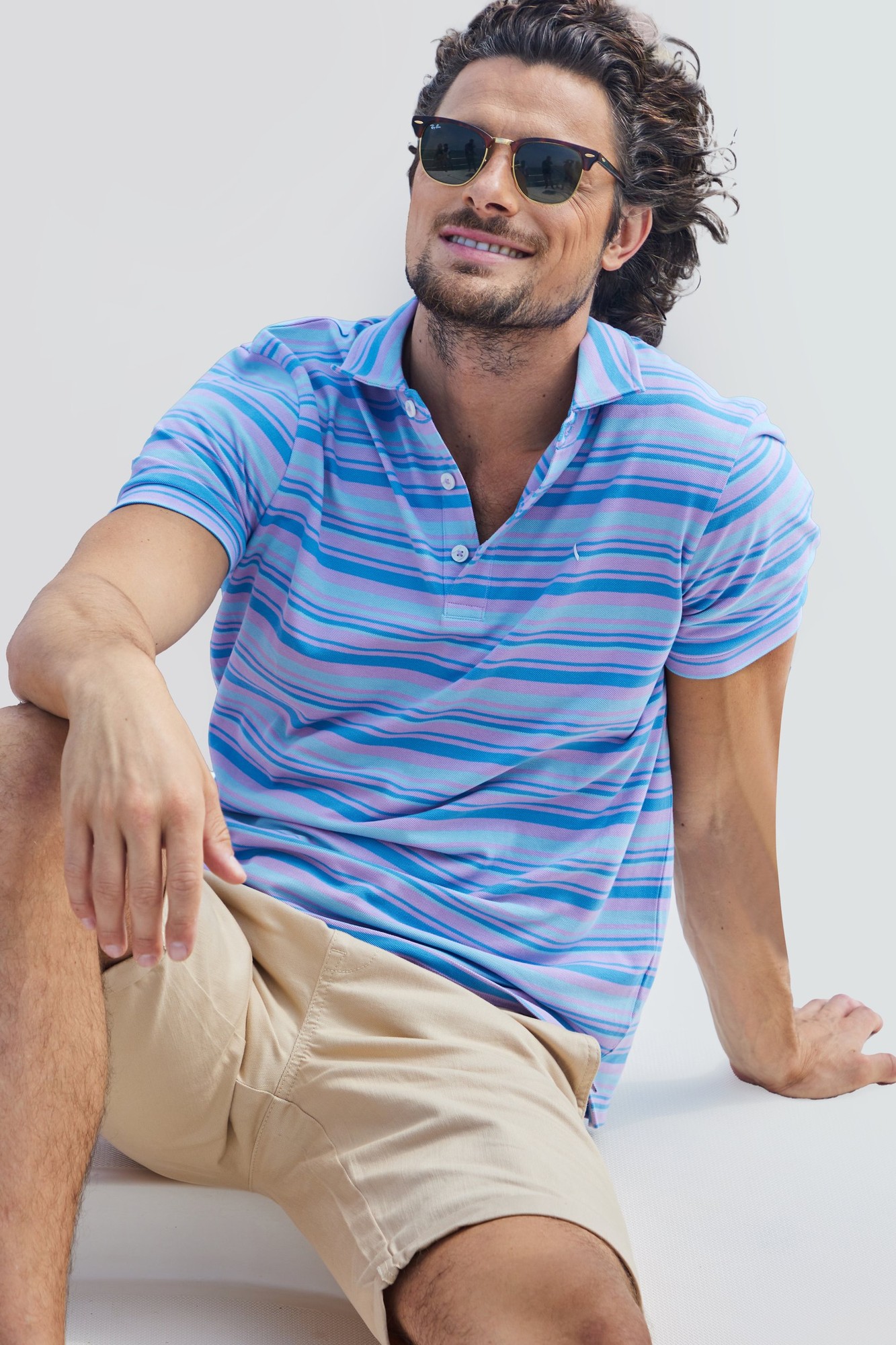 Mens blue casual polo shirt featuring a yarn-dyed striped pattern, short sleeves, and a classic collar, made from lightweight material, size UK M.