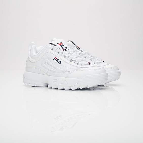 White Fila Disrupter 2 Premium women's mid boots featuring a chunky sole, textured leather upper, and iconic Fila logo on the side and tongue.