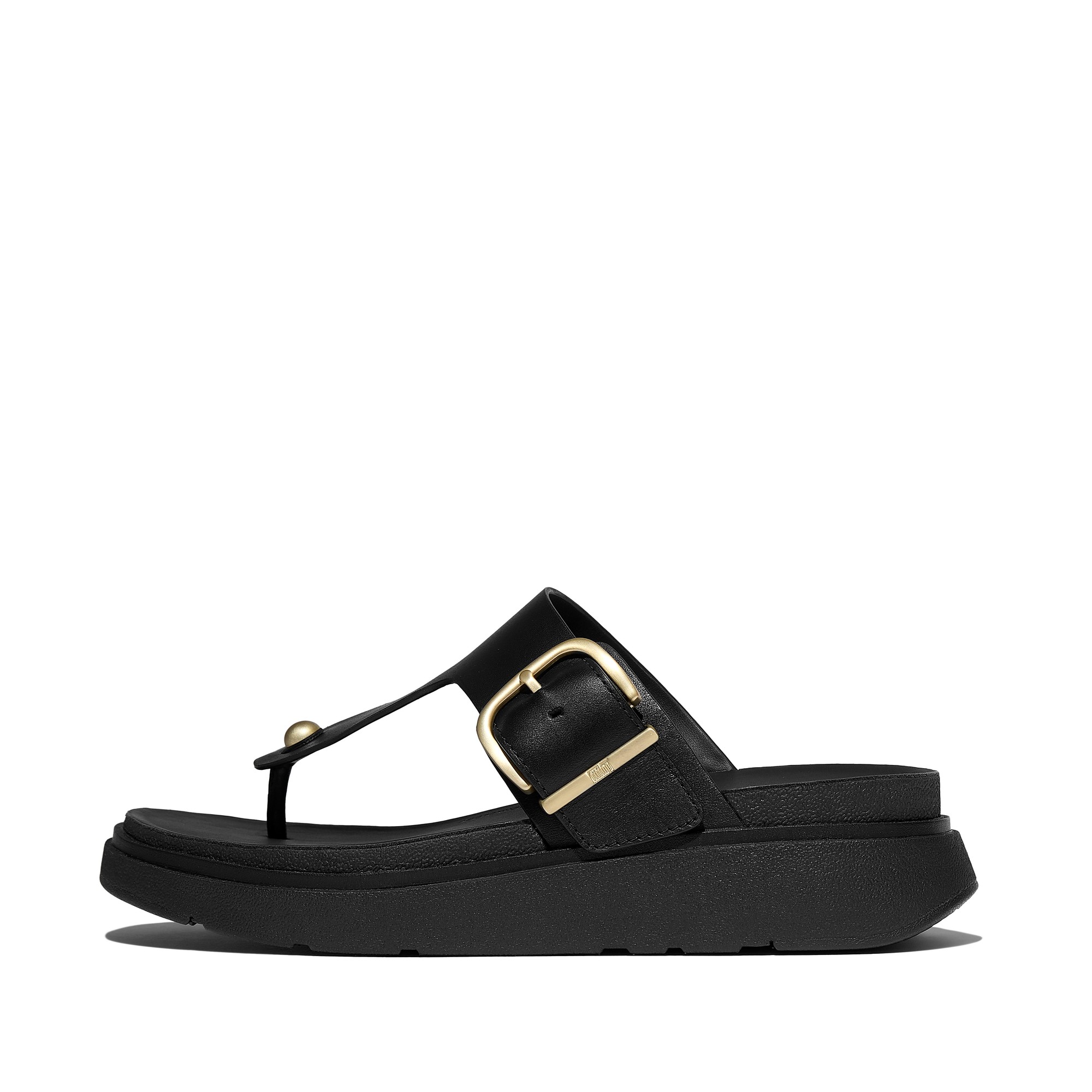 Black leather toe-post sandals featuring a stylish buckle detail and a cushioned sole for comfort, designed by FitFlop.