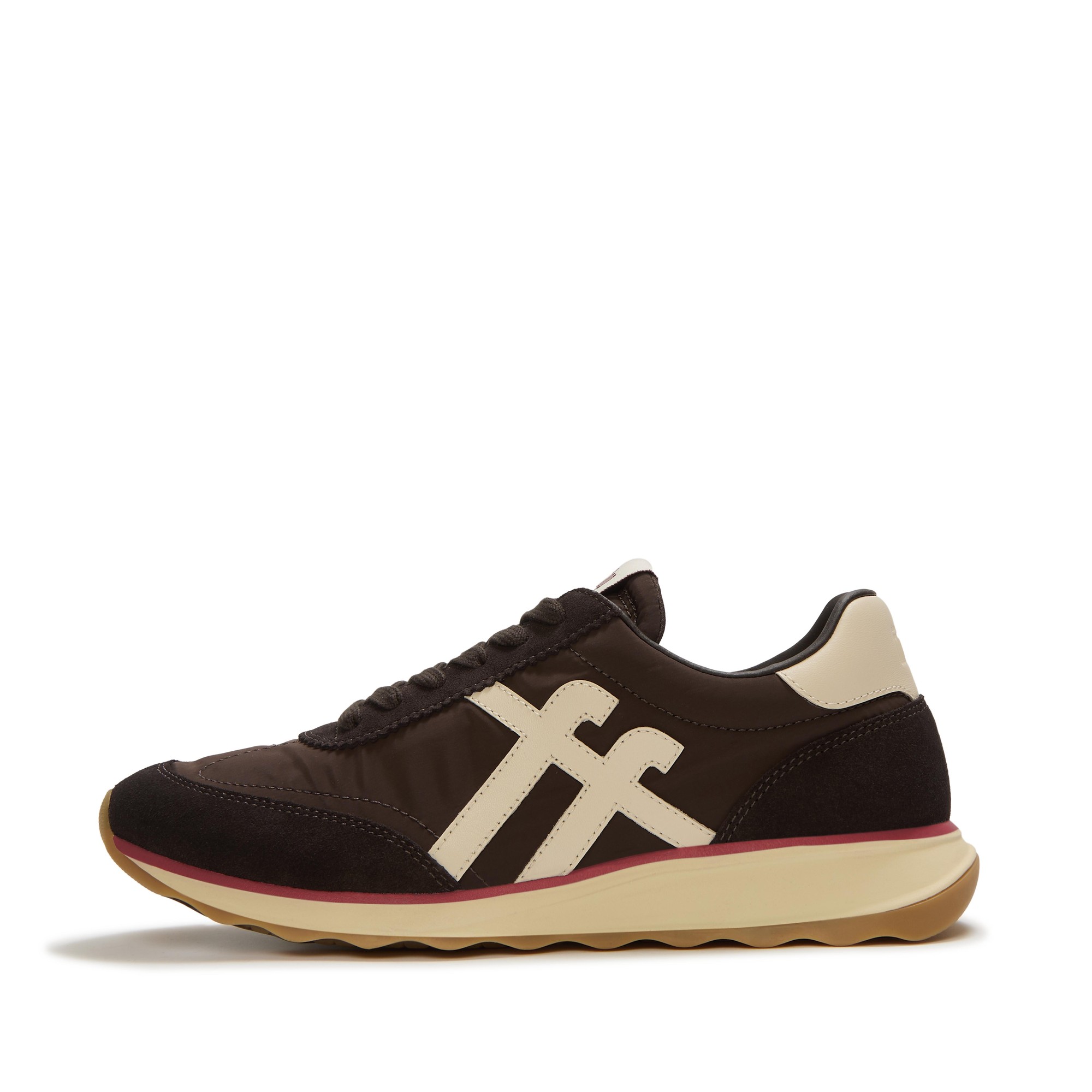 Brown retro trainers featuring a mix of nylon, leather, and suede, with a contrasting cream logo and a cushioned sole in beige and pink accents.
